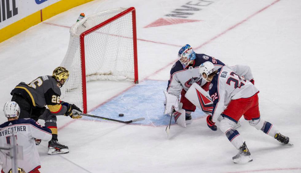 Golden Knights center Mattias Janmark (26) sends the puck into the net past Columbus Blue Jacke ...