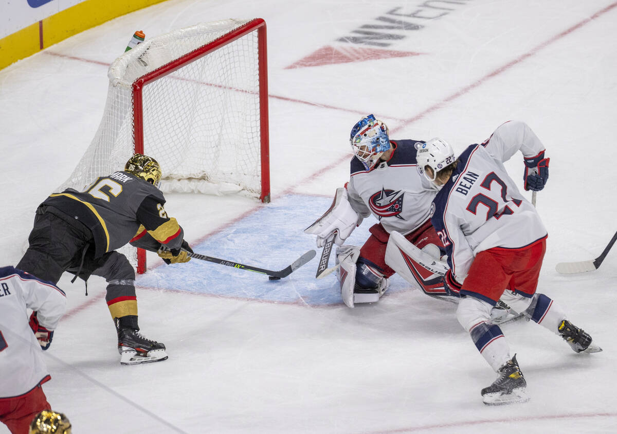 Golden Knights center Mattias Janmark (26) sends the puck into the net past Columbus Blue Jacke ...