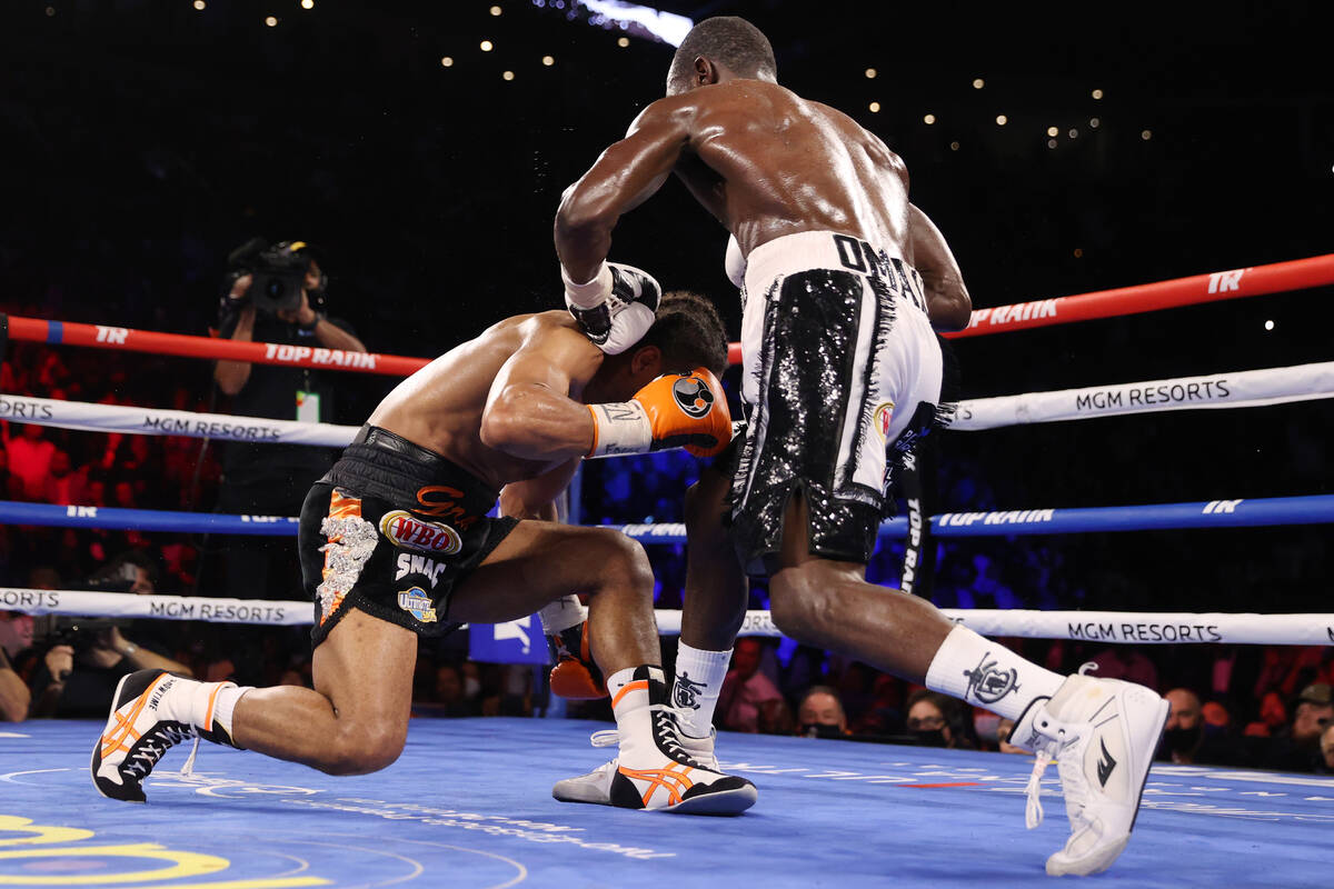 Terence Crawford, right, connects a punch against Shawn Porter to knock him down and to win by ...