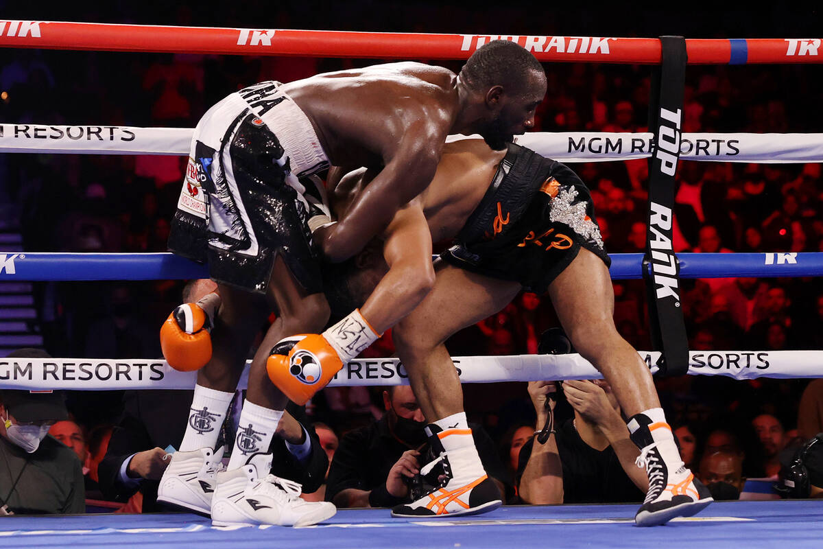 Terence Crawford, left, battles Shawn Porter in the sixth round of a WBO welterweight title fig ...
