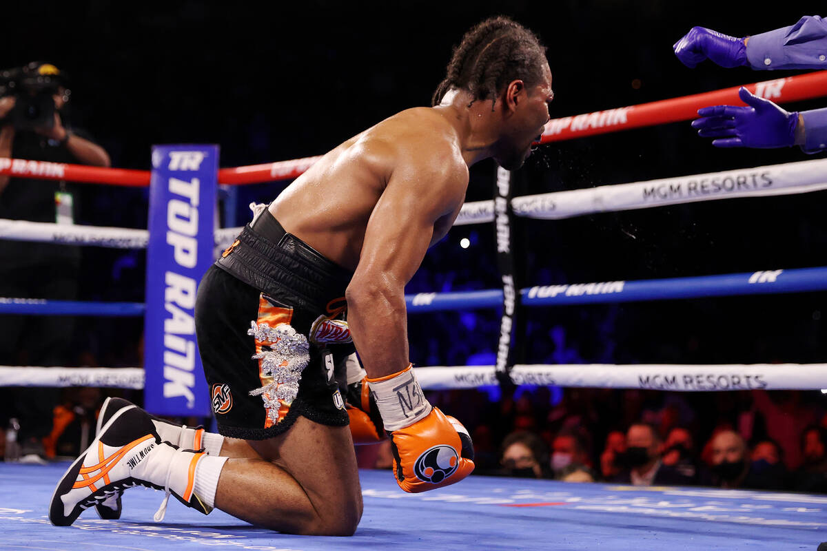 Shawn Porter gets a count after getting knocked down by Terence Crawford in the 10th round of t ...