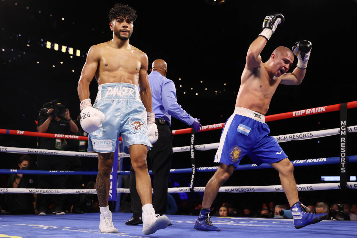 Raymond Muratalla, left, walks away after winning the fight by technical knockout against Elias ...