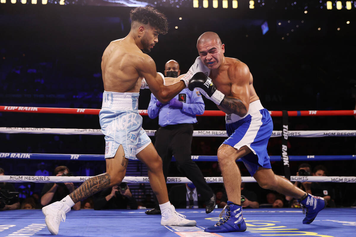 Raymond Muratalla, left, connects a punch against Elias Damian Araujo in the second round of a ...