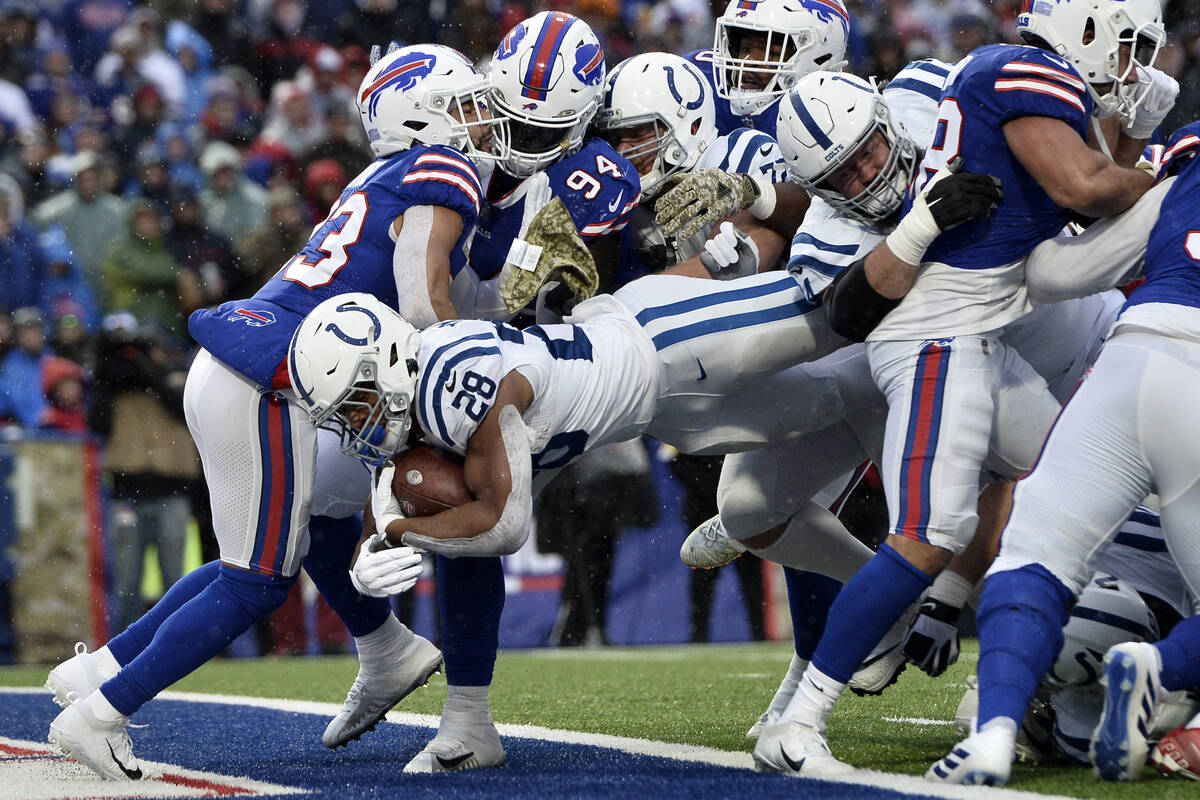 Indianapolis Colts running back Jonathan Taylor (28) dives into the end zone during the first h ...