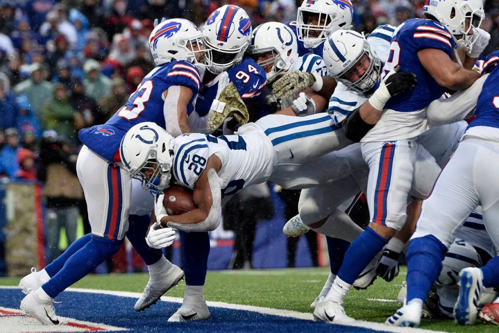 Indianapolis Colts running back Jonathan Taylor (28) dives into the end zone during the first h ...