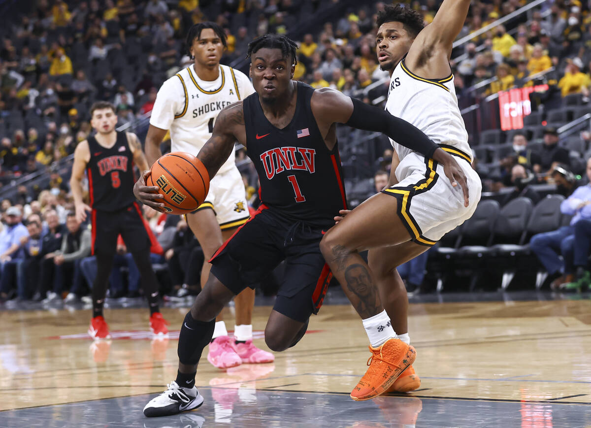 UNLV Rebels guard Michael Nuga (1) drives to the basket against Wichita State Shockers guard Ty ...