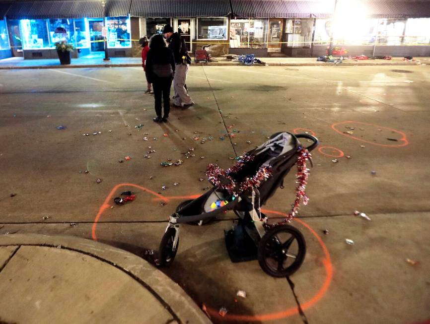 A broken children's stroller lays on West Main Street in downtown Waukesha, Wis., after an SUV ...