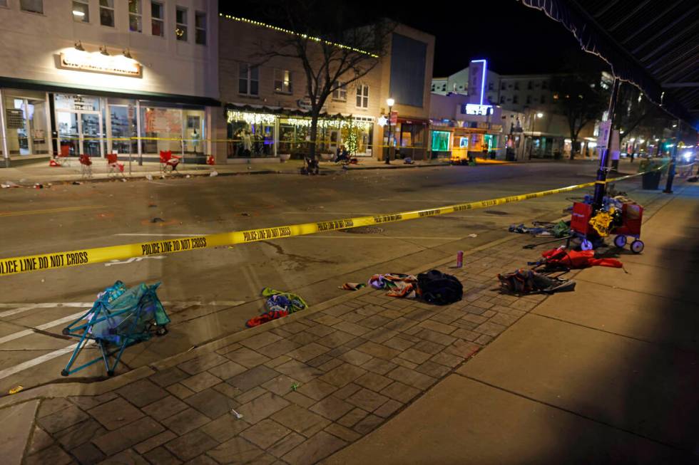 Police tape cordons off a street in Waukesha, Wis., after an SUV plowed into a Christmas parade ...