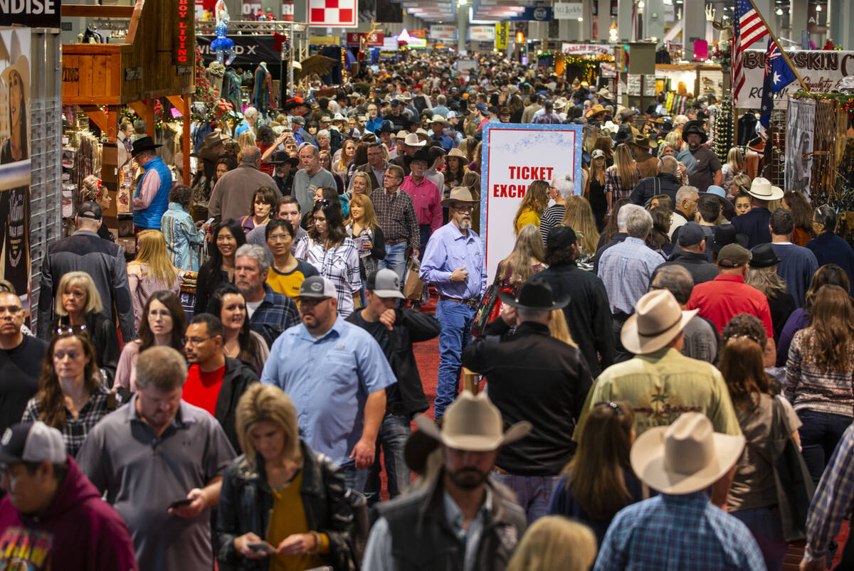 Shoppers wander about during Cowboy Christmas at the Las Vegas Convention Center on Saturday, D ...