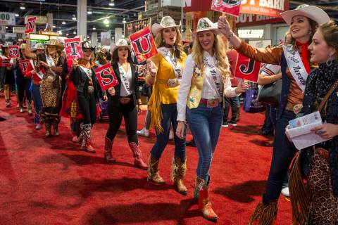 Contestants chant and walk in the Miss Rodeo America Justin Boot Parade during Cowboy Christmas ...
