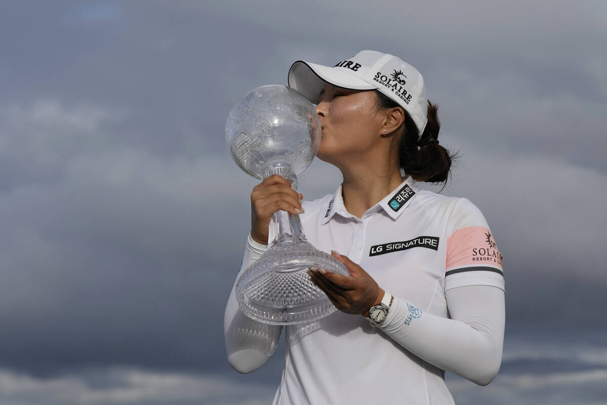 Jin Young Ko, of Korea, kisses the winners trophy after winning the LPGA Tour Championship golf ...
