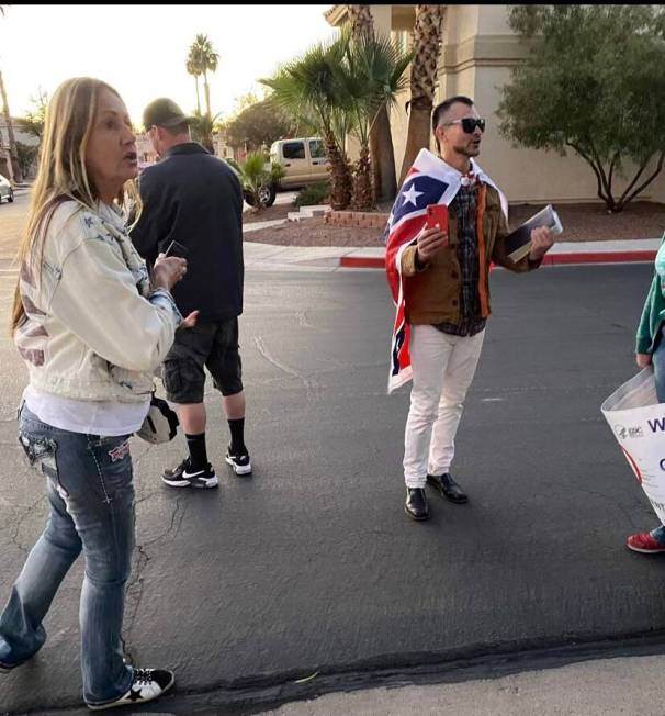 COVID-19 vaccine and mask mandate protesters gather around the Henderson home of Clark County S ...