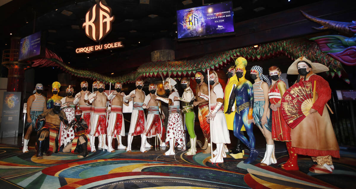 Cirque Du Soleil's KÀ artists pose for a photo in front of the theater before the production's ...