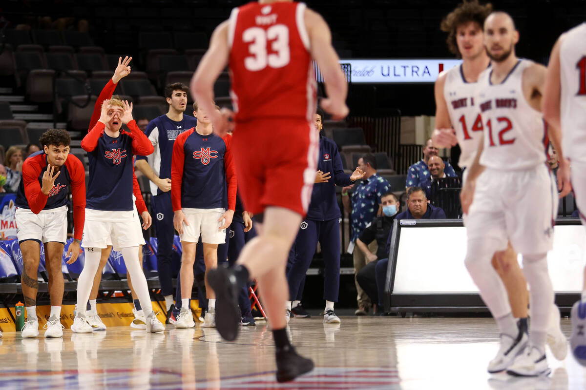 The St. Mary's Gaels bench reacts after a team score against the Wisconsin Badgers during the f ...