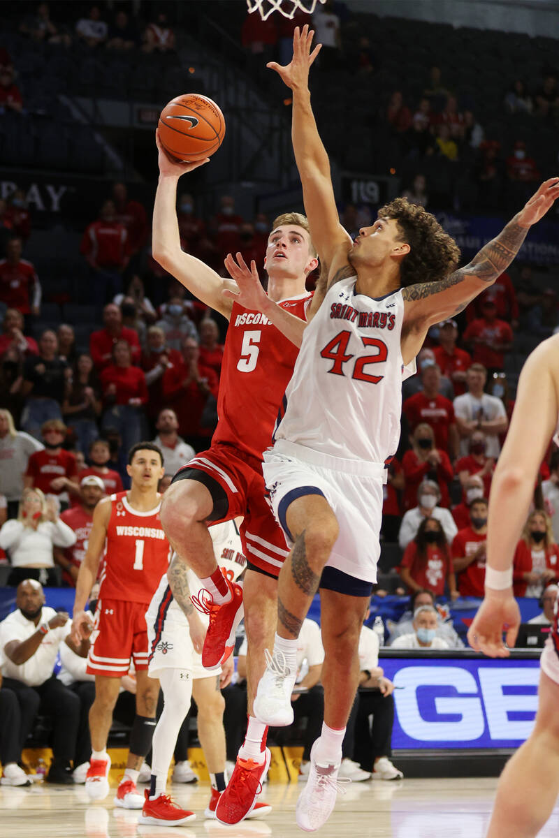 Wisconsin Badgers forward Tyler Wahl (5) goes up for a shot against St. Mary's Gaels forward Da ...
