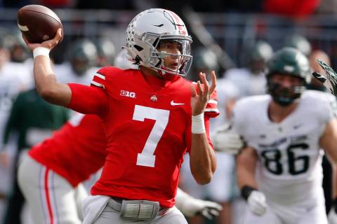 Ohio State quarterback C.J. Stroud plays against Michigan State during an NCAA college football ...