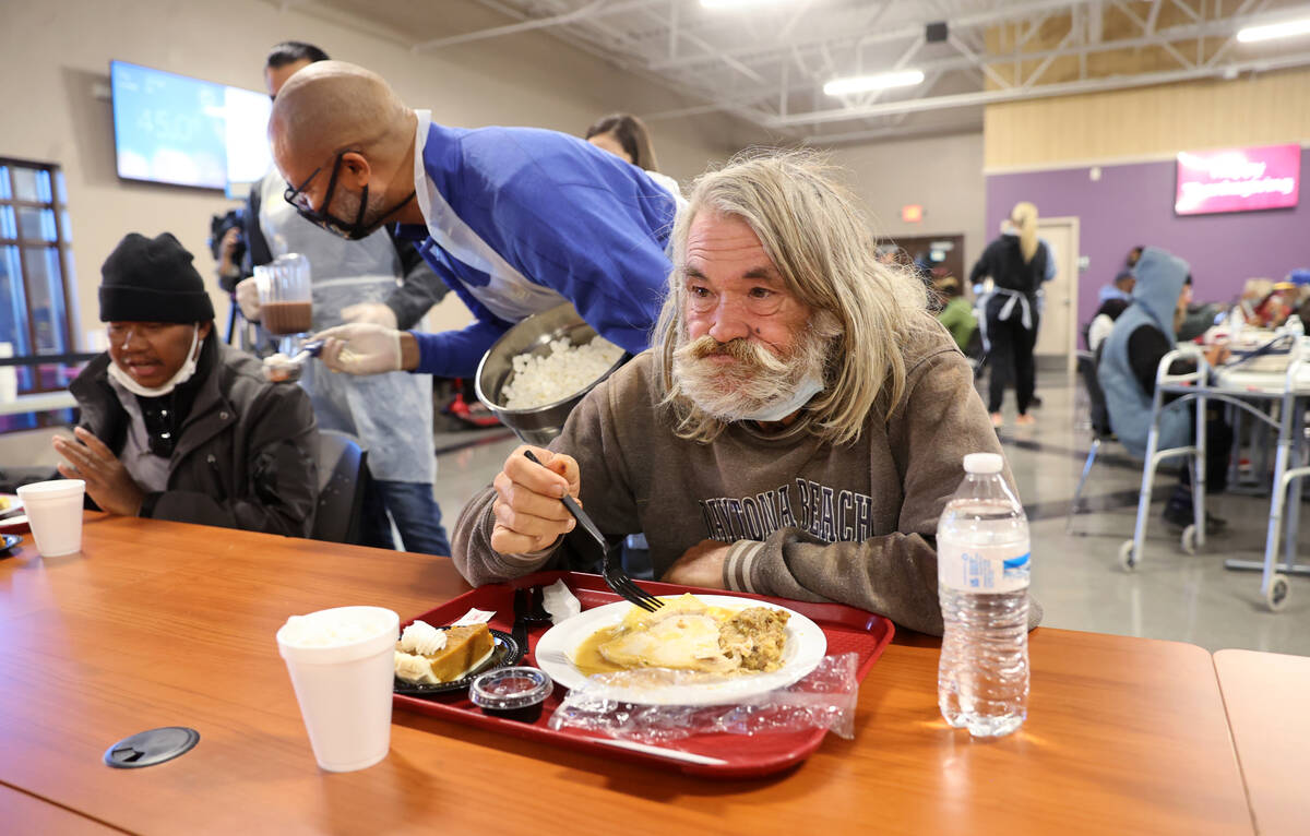 Richard Arlen Curry Jr. eats a free Thanksgiving meal in the renovated St. Vincent Lied Dining ...