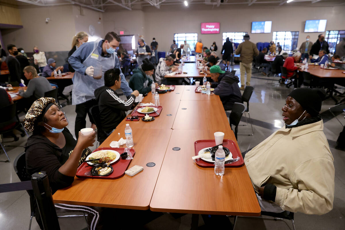 Vaniqueka Dixon and Henry Cook eat a free Thanksgiving meal in the renovated St. Vincent Lied D ...