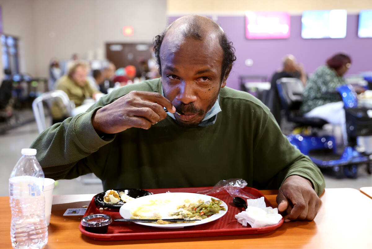 Victor Perkins, 40, eats a free Thanksgiving meal in the renovated St. Vincent Lied Dining Faci ...