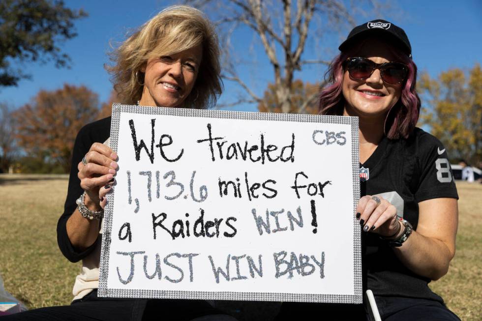 Raiders fans Toni Watson, left, and Ashley Trezza before the start of an NFL football game agai ...