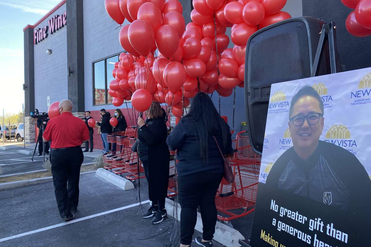 People prepare for a vigil honoring Kenny Lee. (Glenn Puit/Las Vegas Review-Journal)