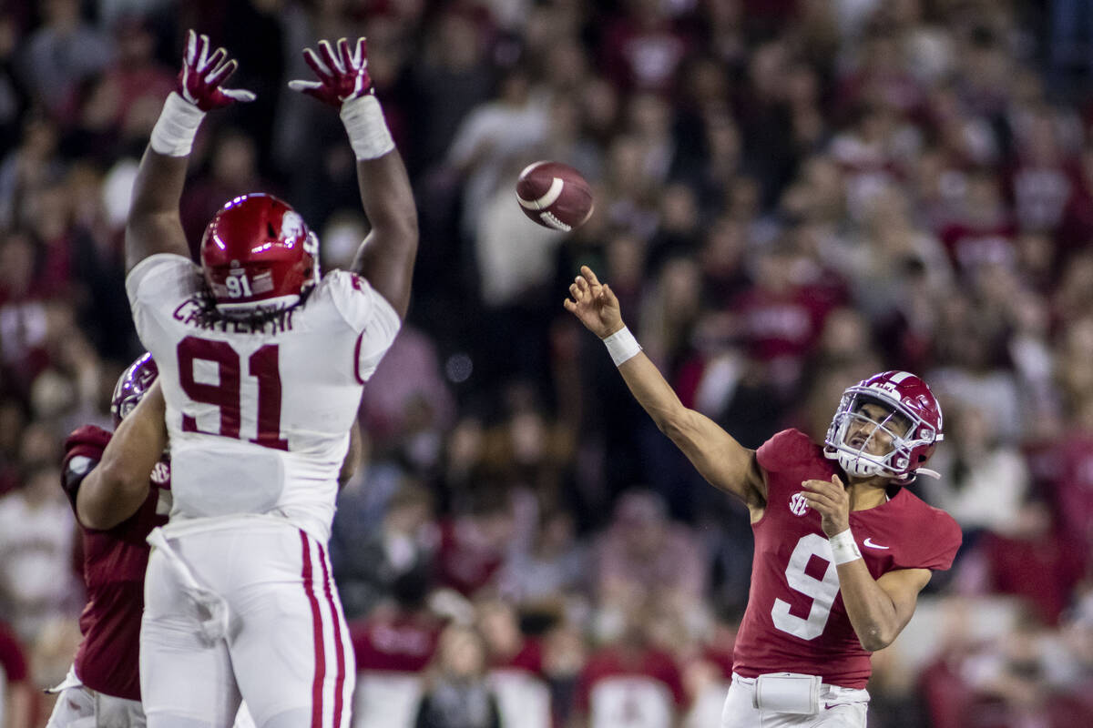 Alabama quarterback Bryce Young (9) throws to wide receiver Jameson Williams for a touchdown du ...