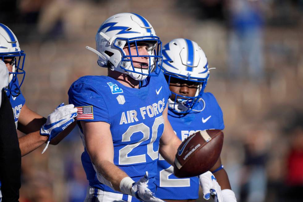 Air Force running back Brad Roberts celebrates after rushing for a touchdown against UNLV in th ...