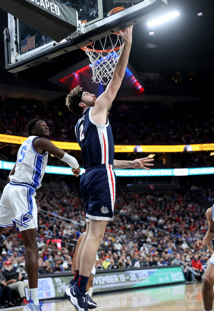 Gonzaga Bulldogs forward Drew Timme (2) lays up past Duke Blue Devils forward Paolo Banchero (5 ...