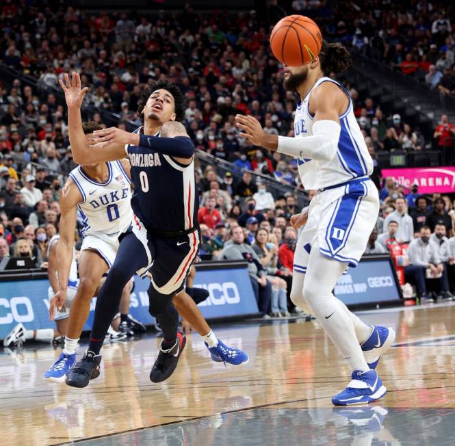 Gonzaga Bulldogs guard Julian Strawther (0) gets the ball tipped from Duke Blue Devils forward ...