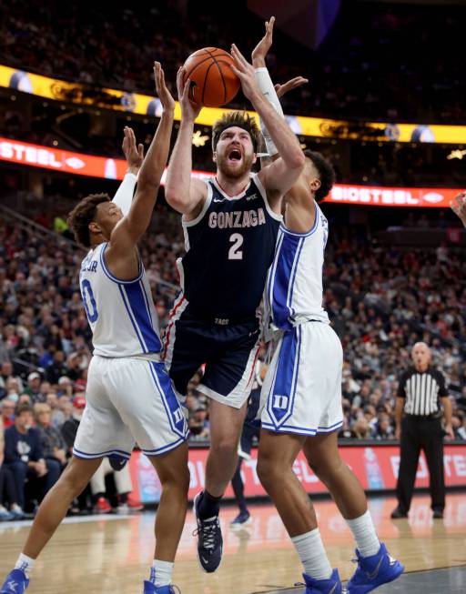 Gonzaga Bulldogs forward Drew Timme (2) shoots between Duke Blue Devils forward Wendell Moore J ...