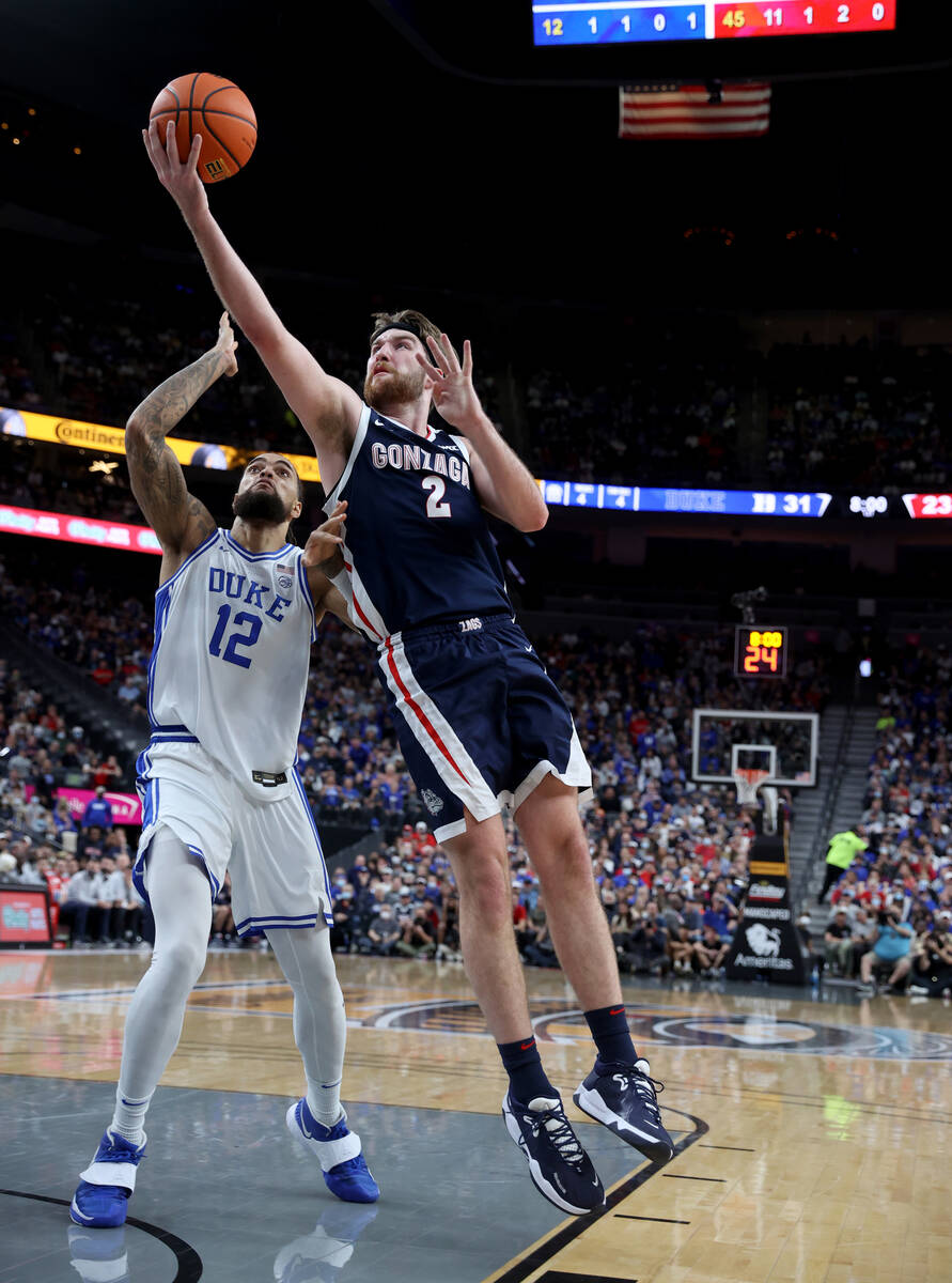 Gonzaga Bulldogs forward Drew Timme (2) shoots past Duke Blue Devils forward Theo John (12) dur ...