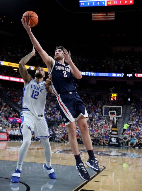 Gonzaga Bulldogs forward Drew Timme (2) shoots past Duke Blue Devils forward Theo John (12) dur ...