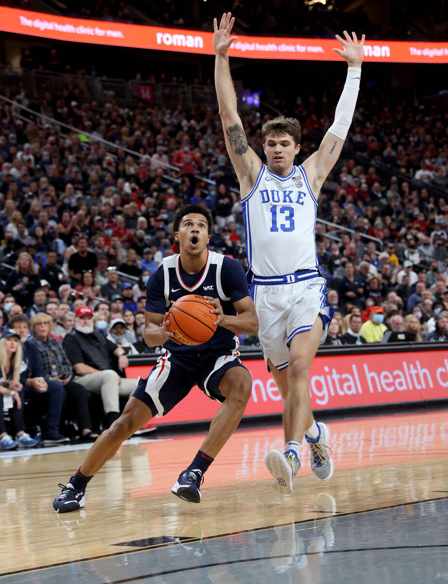 Gonzaga Bulldogs guard Rasir Bolton (45) looks to shoot past Duke Blue Devils forward Joey Bake ...