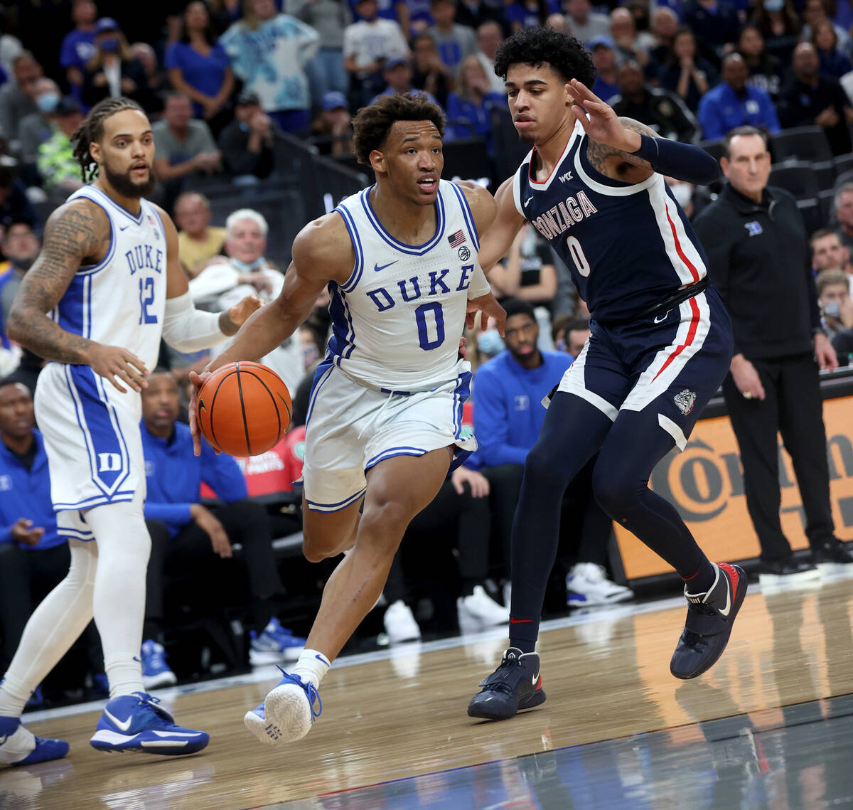 Duke Blue Devils forward Wendell Moore Jr. (0) drives past Gonzaga Bulldogs guard Julian Strawt ...