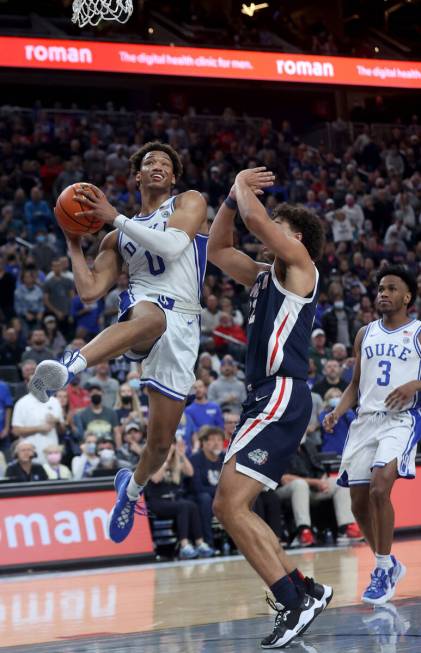 Duke Blue Devils forward Wendell Moore Jr. (0) looks to shoot past Gonzaga Bulldogs forward Ant ...