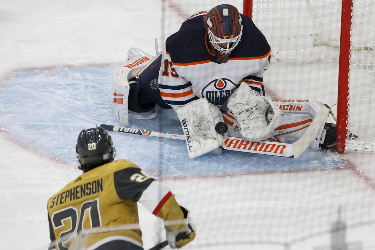 Edmonton Oilers goaltender Mikko Koskinen (19) makes a save against Golden Knights center Chan ...