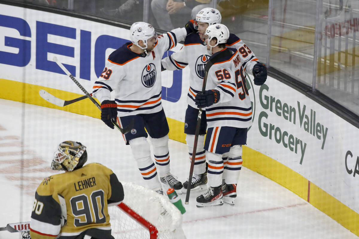 Edmonton Oilers center Ryan Nugent-Hopkins (93) is congratulated by his teammates center Leon D ...