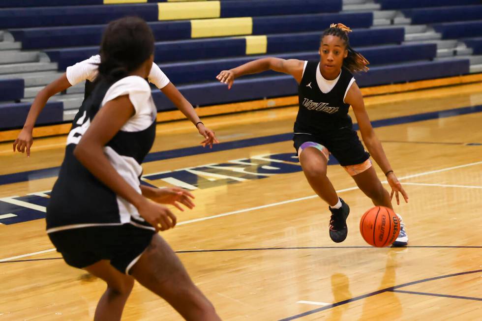 Spring Valley's Aaliyah Gayles, right, drives to the basket during practice at Spring Valley Hi ...