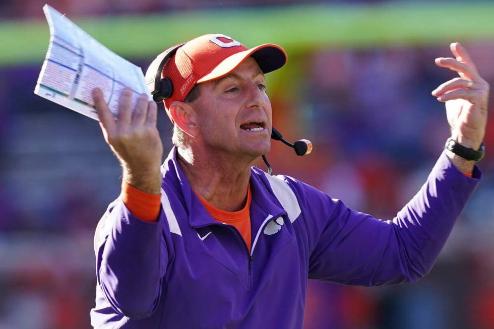 Clemson head coach Dabo Swinney yells towards the players in the second half of an NCAA college ...