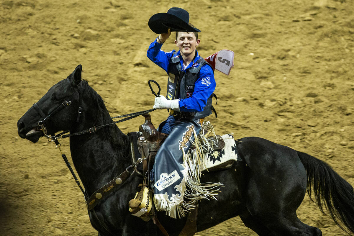 Stetson Wright of Milford, Utah, salutes the crowd after taking first place atop of Holy Holly ...