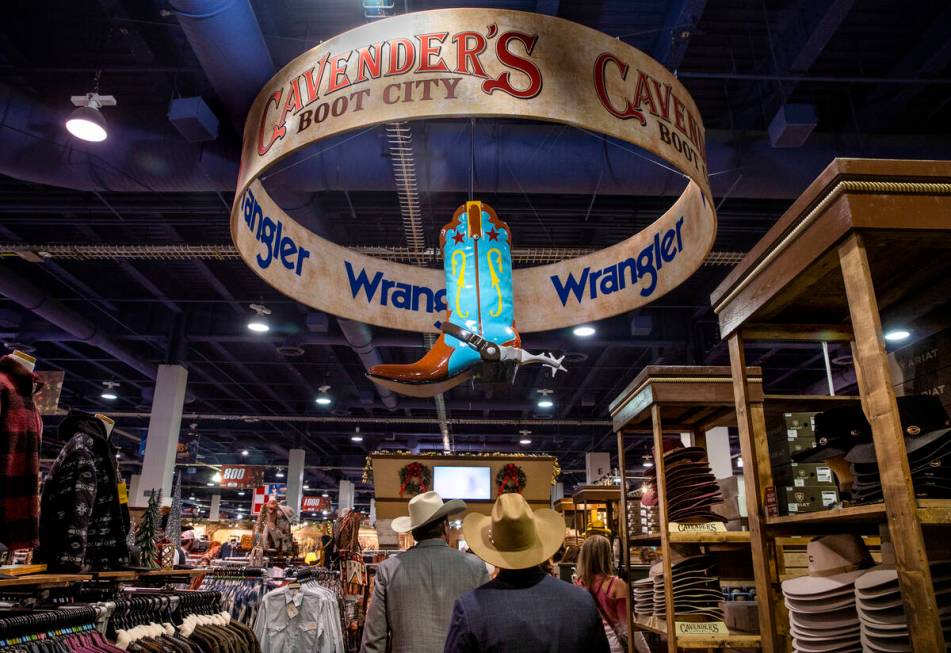Shoppers check out some of the merchandise from CavnenderÕs Boot city during the opening n ...
