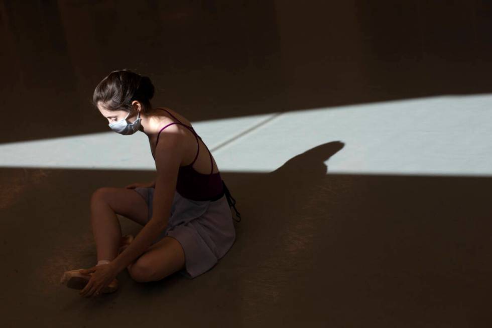 Emma McGirr stretches during a rehearsal for the upcoming presentation of "The Nutcracker" at N ...