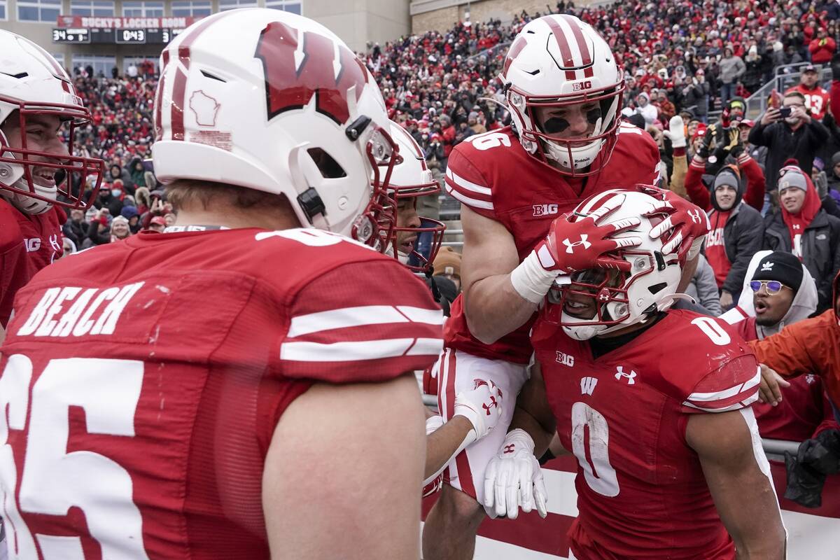 Wisconsin's Braelon Allen is congratulated by teammates after running for a touchdown during th ...