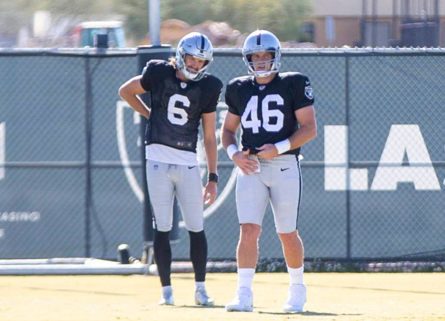 Raiders long snapper Carson Tinker (46) works with Raiders punter A.J. Cole (6) during practice ...