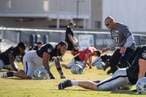 Raiders interim head coach Rich Bisaccia, right, motions to Raiders guard Jeremiah Poutasi (79) ...