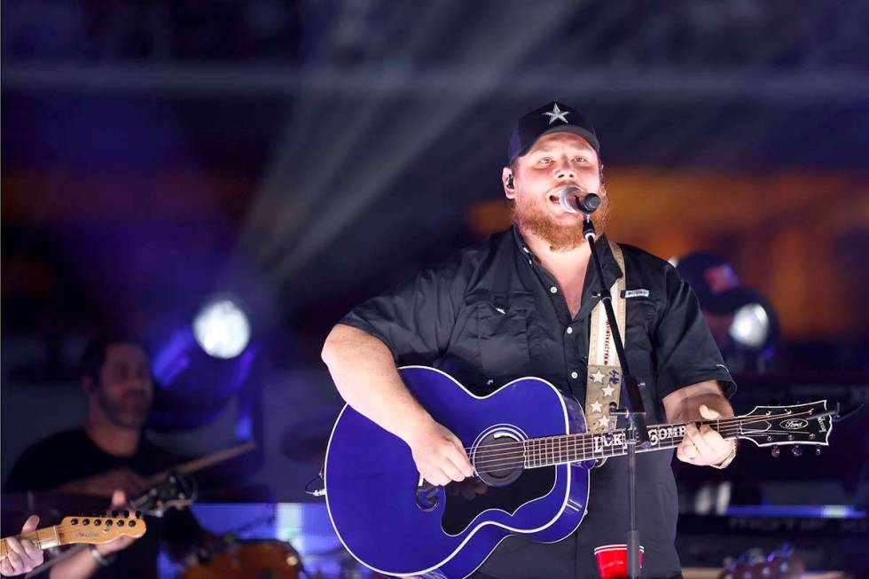 Luke Combs performs at halftime of an NFL football game between the Las Vegas Raiders and Dalla ...