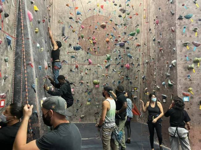 Youth participants of the Metropolitan Police Department's DREAM program give indoor rock climb ...