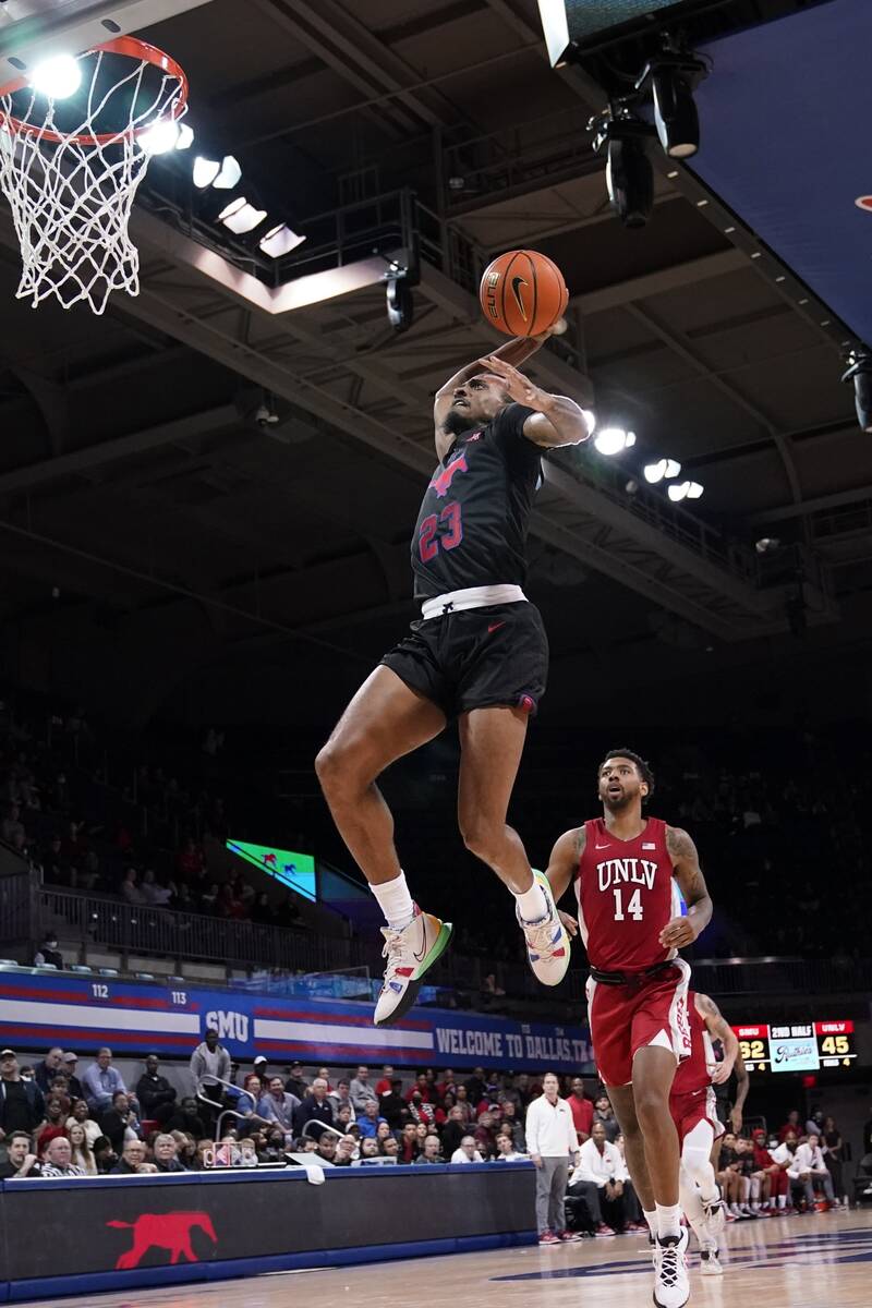 SMU guard Michael Weathers (23) goes up to dunk after getting past UNLV forward Royce Hamm Jr. ...