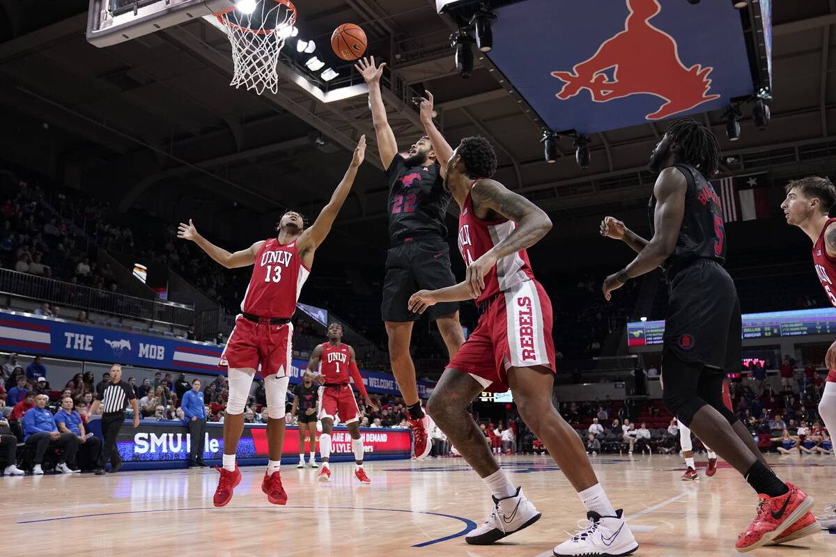 UNLV guard Bryce Hamilton (13) and Trey Hurlburt, center right, defend as SMU forward Isiah Jas ...