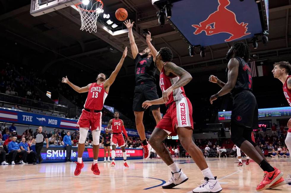 UNLV guard Bryce Hamilton (13) and Trey Hurlburt, center right, defend as SMU forward Isiah Jas ...